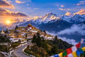 A breathtaking panoramic view of a Buddhist monastery perched on a hillside, surrounded by snow-capped peaks, prayer flags, and lush greenery, bathed in the warm light of early or late sunlight.